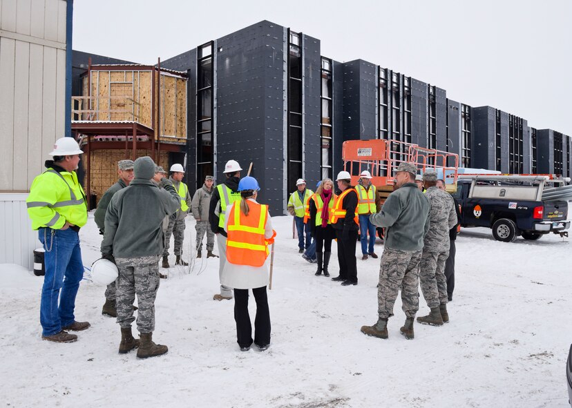 Base leadership tours the new temporary lodging facility site, currently under construction at Minot Air Force Base, N.D., Jan. 20, 2016.  The new facility will double the lodging capacity for Airmen and their families transitioning onto and off the base. (U.S. Air Force photos/Airman 1st Class J.T. Armstrong)

