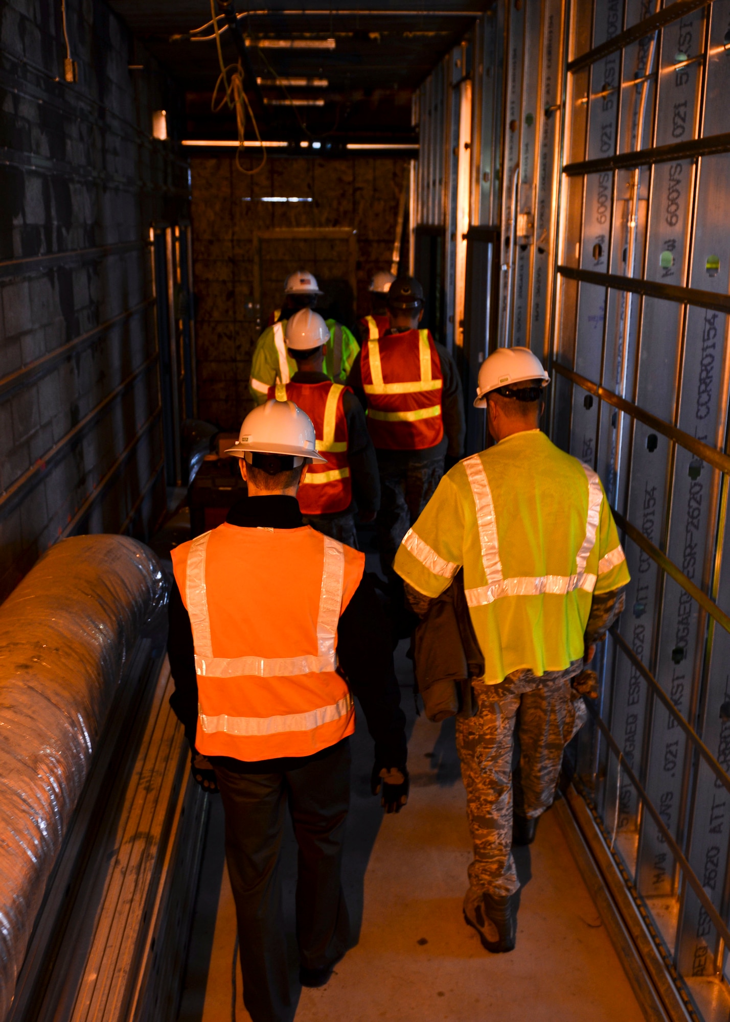 Base leadership tours the new temporary lodging facility site, currently under construction at Minot Air Force Base, N.D., Jan. 20, 2016.  The new facility will double the lodging capacity for Airmen and their families transitioning onto and off the base. (U.S. Air Force photos/Airman 1st Class J.T. Armstrong)
