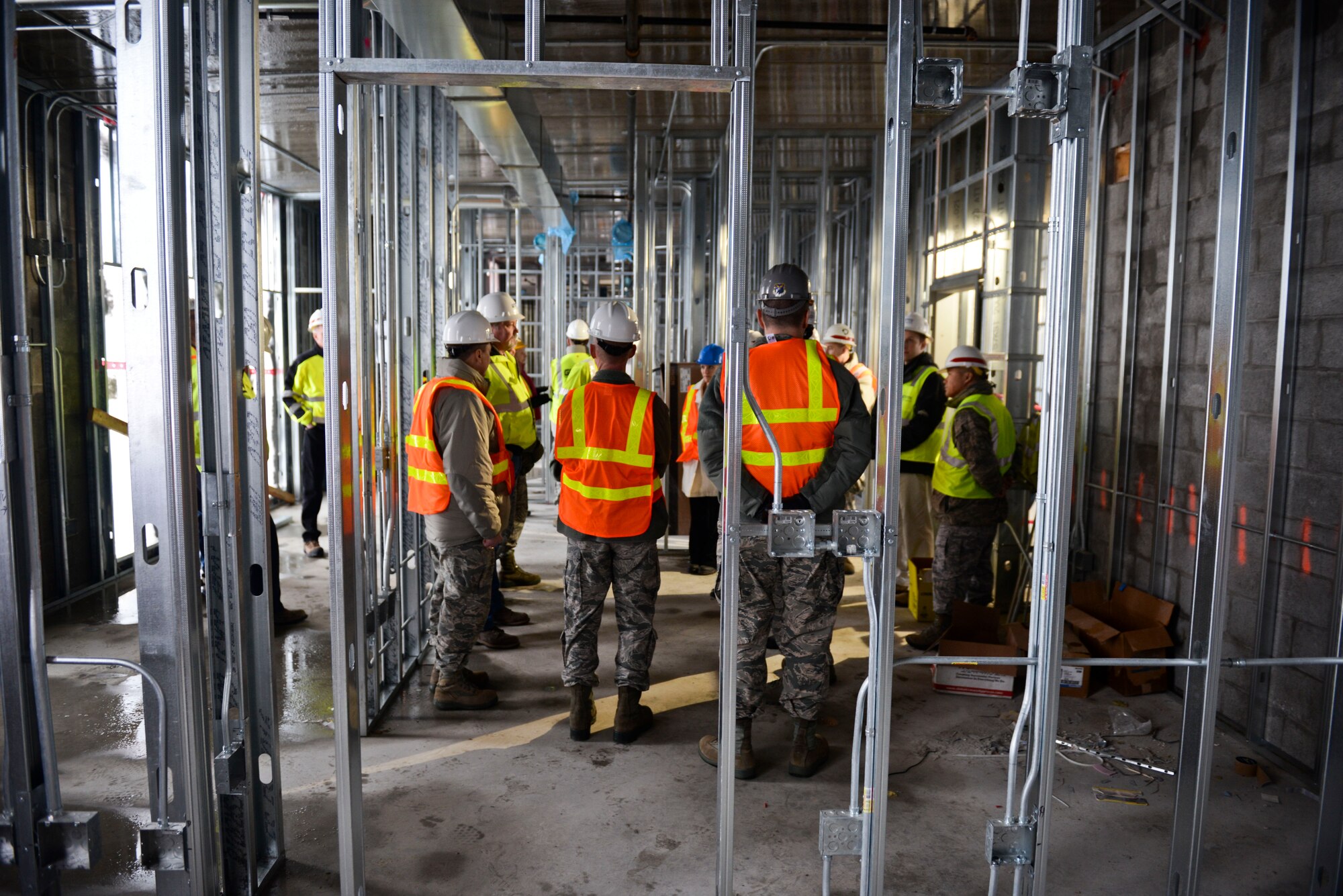 Base leadership tours the new temporary lodging facility site, currently under construction at Minot Air Force Base, N.D., Jan. 20, 2016.  The new facility will double the lodging capacity for Airmen and their families transitioning onto and off the base. (U.S. Air Force photos/Airman 1st Class J.T. Armstrong)