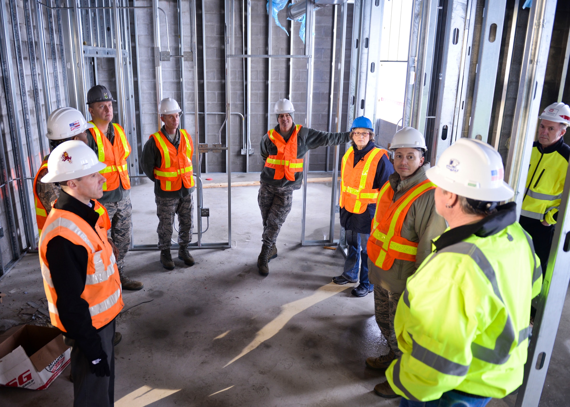 Base leadership tours the new temporary lodging facility site, currently under construction at Minot Air Force Base, N.D., Jan. 20, 2016.  The new facility will double the lodging capacity for Airmen and their families transitioning onto and off the base. (U.S. Air Force photos/Airman 1st Class J.T. Armstrong)