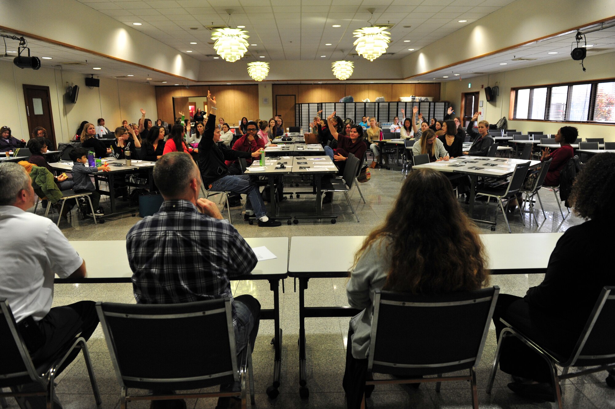 Team Kadena Key Spouses hold a question and answer panel with military family members during a new spouse orientation at the Schilling Community Center, Jan. 26, 2016, at Kadena Air Base, Japan. The panel shared experiences of Japanese culture and answered questions regarding quality of life and overseas military living. (U.S. Air Force
photo by Senior Airman Peter Reft)
