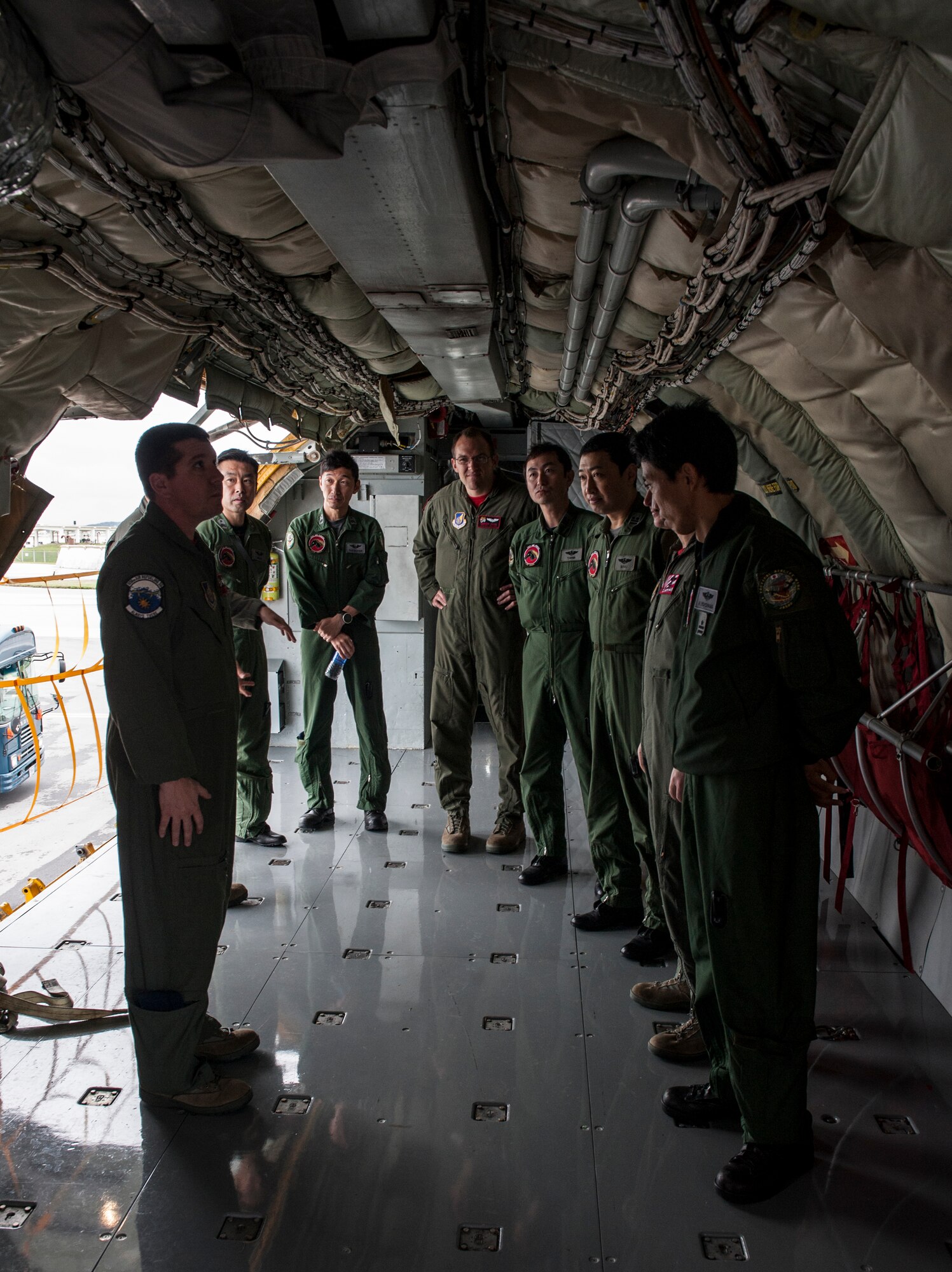 Members of Kadena’s 909th Air Refueling Squadron and the Japan Air Self Defense Force’s 404th ARS tour the different parts of the KC-135 Stratotanker Jan. 22, 2016, at Kadena Air Base, Japan. The 909th showed the 404th their aircraft so both teams could discuss similarities and differences of their respective airframes. The 404th flies the KC-767, which has different capabilities than the KC-135. (U.S. Air Force photo by Airman 1st Class Lynette M. Rolen)