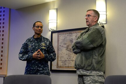 U.S. Navy Adm. Cecil D. Haney (left), U.S. Strategic Command commander, speaks with U.S. Air Force Gen. John E. Hyten, Air Force Space Command commander, during the Joint Interagency Combined Space Operations Centerâ€™s (JICSpOC) distinguished visitor day at Schriever Air Force Base, Colo., Jan. 26, 2016. The JICSpOC became operational in October 2015 through the partnership and collaborative efforts of USSTRATCOM, the National Reconnaissance Office, Air Force Space Command, the Air Force Research Laboratory, the intelligence community and commercial data providers who recognized the need to leverage existing Joint Space Operations Center (JSpOC) mission systems upgrades and include additional systems and capabilities from their respective organizations. These capabilities enable a more integrated unity of effort between the DoD and intelligence community as they confront the challenges of operating in the contested, congested and competitive space environment. Haney and other senior leaders attended the event to observe the JICSpOCâ€™s capabilities, to receive an update on the experimentation conducted to date during the first phase of its operations and to discuss space-related issues. One of nine DoD unified combatant commands, USSTRATCOM has global strategic missions, assigned through the Unified Command Plan, which include strategic deterrence; space operations; cyberspace operations; joint electronic warfare; global strike; missile defense; intelligence, surveillance and reconnaissance; combating weapons of mass destruction; and analysis and targeting. (U.S. Air Force photo by Christopher DeWitt)