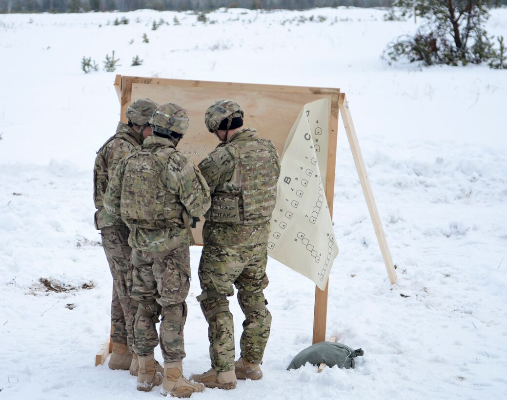 Soldiers set up a target for the M240 machine gun range during a training exercise at Adazi Training Area in Latvia, Jan. 25, 2016. Army photo by Staff Sgt. Steven Colvin
