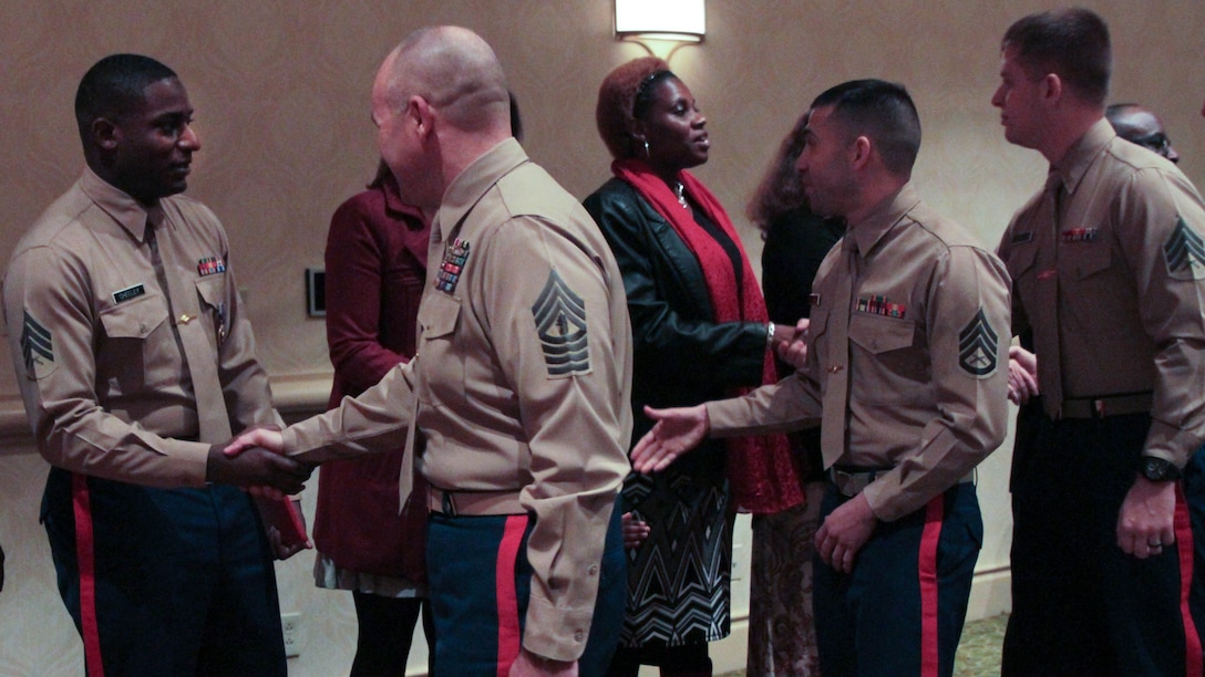 Marines congratulate Sgt. DeMonte R. Cheeley on receiving the Purple Heart medal Jan. 26, 2016, at a ceremony in Chattanooga, Tenn. Cheeley received the Purple Heart for injuries he sustained during a July 16, 2015 attack in Chattanooga at the Armed Forces Career Center where he works. Cheeley is a Marine recruiter with Recruiting Substation Chattanooga, Recruiting Station Nashville, Tenn. 