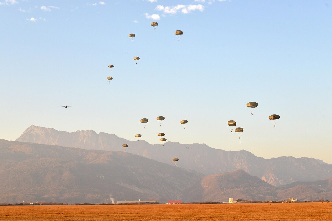 Army paratroopers participate in an airborne operation from a U.S. Air Force C-130 Hercules aircraft over Juliet drop zone in Pordenone, Italy, Jan. 20, 2016. U.S. Army photo by Davide Dalla Massara