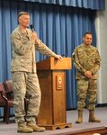 DLA Director Lt. Gen. Andrew Busch, left, with Command Sgt. Maj. Charles Tobin, right, speak to DLA Distribution Red River, Texas, employees at the Dec. 18 Town Hall.