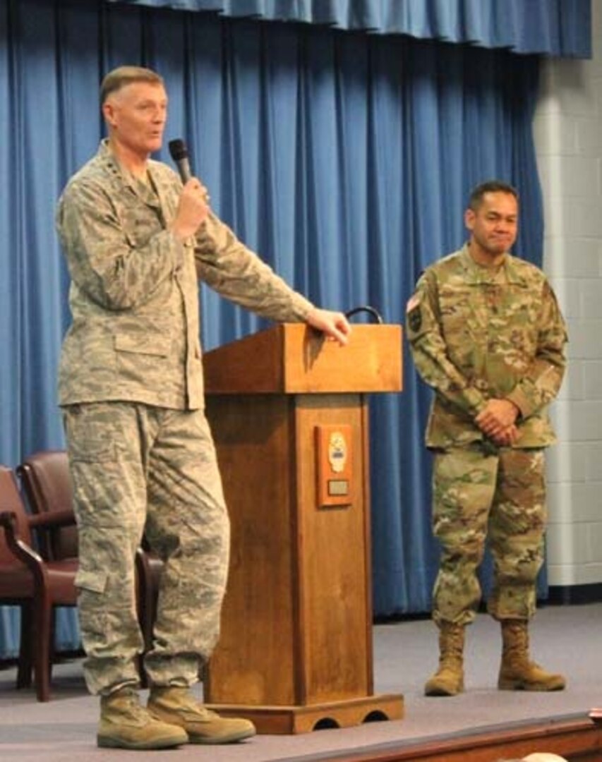 DLA Director Lt. Gen. Andrew Busch, left, with Command Sgt. Maj. Charles Tobin, right, speak to DLA Distribution Red River, Texas, employees at the Dec. 18 Town Hall.