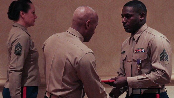 Sgt. DeMonte R. Cheeley is presented the Purple Heart medal by Brig. Gen. Terry V. Williams Jan. 26, 2015, at a ceremony in Chattanooga, Tenn. Cheeley received the Purple Heart for injuries he sustained during a July 16, 2015 attack in Chattanooga at the Armed Forces Career Center where he works. An investigation conducted by the FBI and the Naval Criminal Investigative Service determined the attack had been inspired by a foreign terrorist group making Cheeley eligible for the Purple Heart. Cheeley is a Recruiting Substation Chattanooga recruiter in Chattanooga, Tenn. Williams is the Commanding General of Marine Corps Recruit Depot Parris Island and Eastern Recruiting Region. 