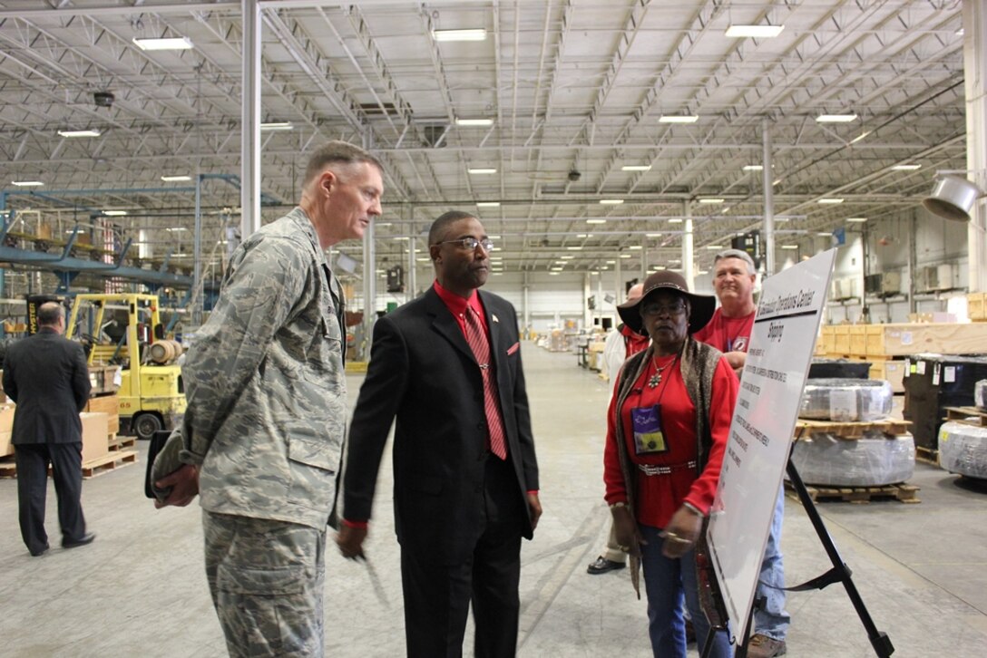 Glenn Cason and Dianna Culberson, Red River employees, serve as tour guides for DLA Director Lt. Gen. Andrew Busch during his Dec. 18, visit to DLA Distribution Red River, Texas. Glenn Cason and Dianna Culberson, Red River employees, serve as tour guides for DLA Director Lt. Gen. Andrew Busch during his Dec. 18, visit to DLA Distribution Red River, Texas 
 
