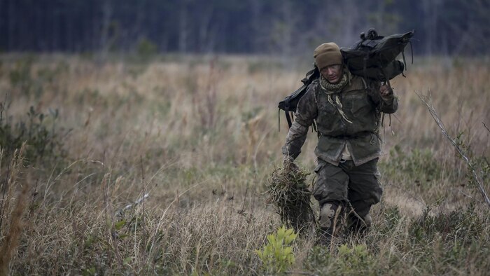 A Marine student undergoing the 2nd Marine Division Combat Skills Center’s Pre-Scout Sniper Course departs a field following a stalking exercise at Marine Corps Base Camp Lejeune, North Carolina, Jan. 22, 2016. The DCSC offers several infantry-based courses to enhance the combat readiness of its Marines.