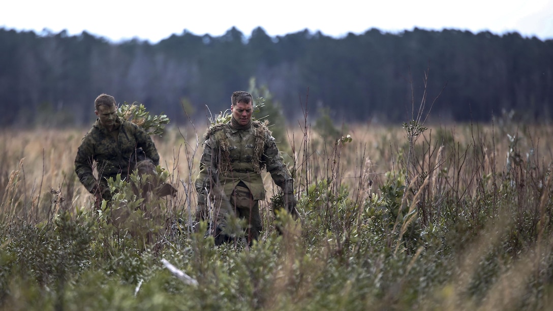 Marine students undergoing the 2nd Marine Division Combat Skills Center’s Pre-Scout Sniper Course depart a field following a stalking exercise at Marine Corps Base Camp Lejeune, North Carolina, Jan. 22, 2016. The exercise required students to traverse approximately 1,000 meters of high grass and fire on a target, all without being detected.