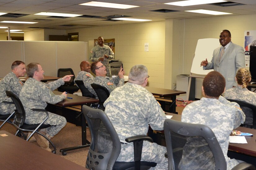 Samuel Pugh, outreach coordinator with the Birmingham Civil Rights Institute, engages Soldiers during his presentation on the historical events that led up to the signing of the Civil Rights Act of 1964.