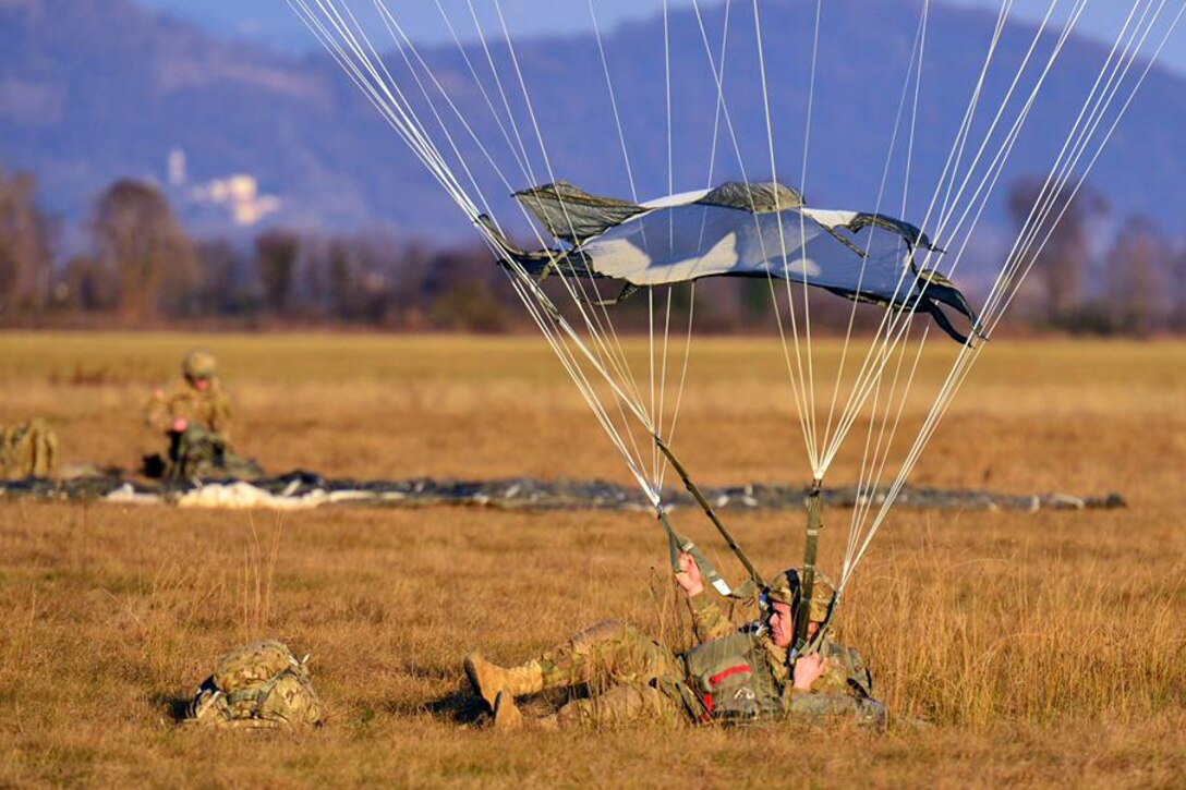 A 173rd Airborne Brigade paratrooper lands onto Juliet drop zone in Pordenone, Italy, Jan. 21, 2016. Army photo by Paolo Bovo