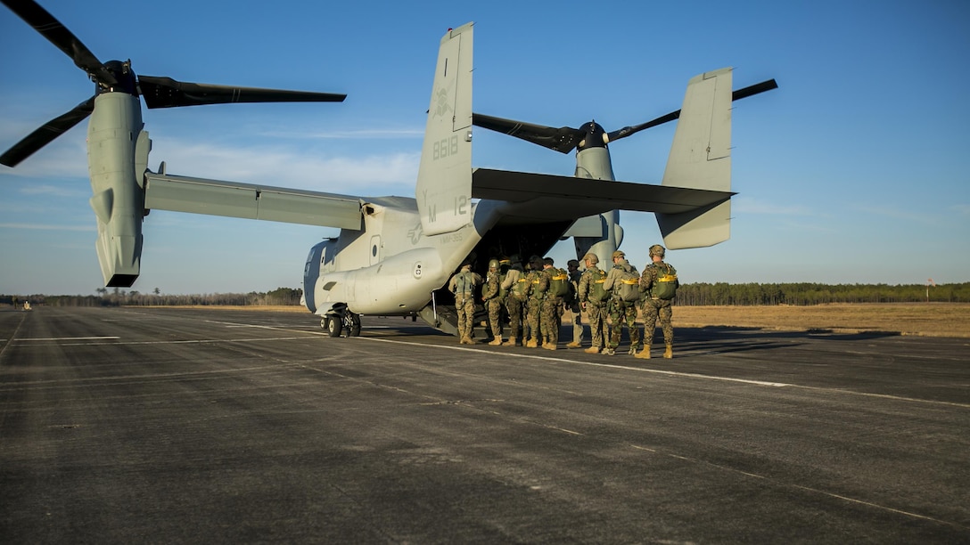 Marines with U.S. Marine Corps Forces, Special Operations Command board an MV-22B Osprey to conduct parachute operations with Marine Medium Tiltrotor Squadron 365 at Marine Corps Air Station New River, North Carolina, Jan. 21, 2016. The squadron supported Marine Raiders by conducting high altitude low opening jumps as well as static line jumps to allow Marine Raiders to train for future operations.
