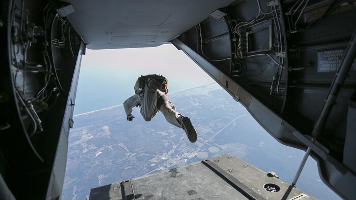 Marines with U.S. Marine Corps Forces, Special Operations Command dive out the back of a MV-22B Osprey with the goal of hitting their pre-designated landing zone with Marine Medium Tiltrotor Squadron 365 at Marine Corps Air Station New River, North Carolina, Jan. 21, 2016. The squadron supported Marine Raiders by conducting high altitude low opening jumps as well as static line jumps to allow them to train for future operations.