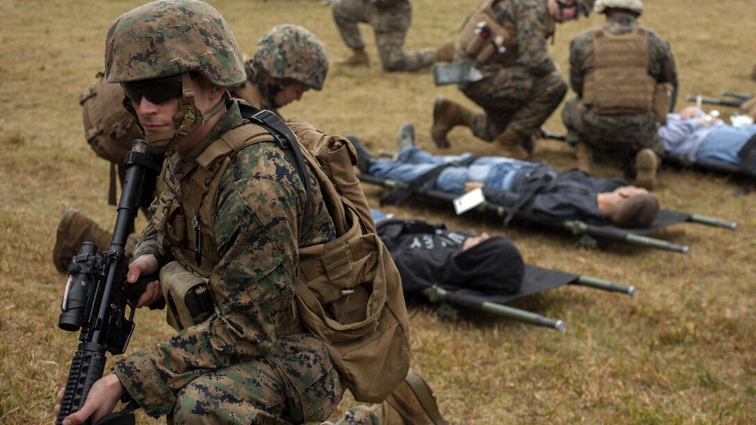 A Marine with Combat Logistics Battalion 31, 31st Marine Expeditionary Unit, holds security during a mass casualty drill Jan. 21, 2016 at Camp Hansen, Okinawa, Japan. The Marines were participating in a noncombatant evacuation operation training exercise when simulated insurgents attacked and wounded several Marines and evacuees. The 31st MEU responds to mass casualty situations with a quick reaction force known as ‘Nightingale’. The Marines fly in with Navy corpsmen and a small amount of medical equipment so they are able to quickly triage and evacuate the casualties.