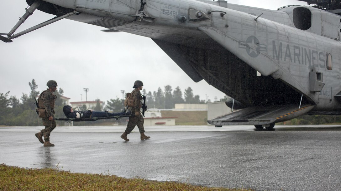 Marines with Combat Logistics Battalion 31, 31st Marine Expeditionary Unit, move a simulated casualty onto a CH-53E Super Stallion Jan. 21, 2016 at Camp Hansen, Okinawa, Japan. The Marines were participating in a noncombatant evacuation operation training exercise when simulated insurgents attacked and wounded several Marines and evacuees. The 31st MEU responds to mass casualty situations with a quick reaction force known as ‘Nightingale’. The Marines fly in with Navy corpsmen and a small amount of medical equipment so they are able to quickly triage and evacuate the casualties.