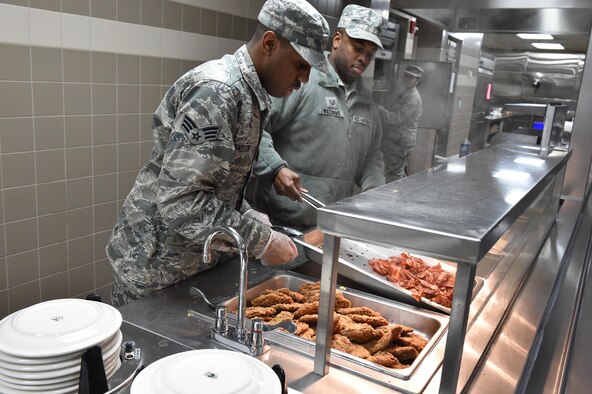 Senior Airman Kyle Slaughter, a food services specialist with the 910th Force Support Squadron, prepares country fried steak for lunch here, Jan. 10, 2016. The Force Support Squadron serves five meals for approximately 1300 airmen during unit training assembly weekends. (U.S. Air Force photo/ Tech. Sgt. Rick Lisum)
