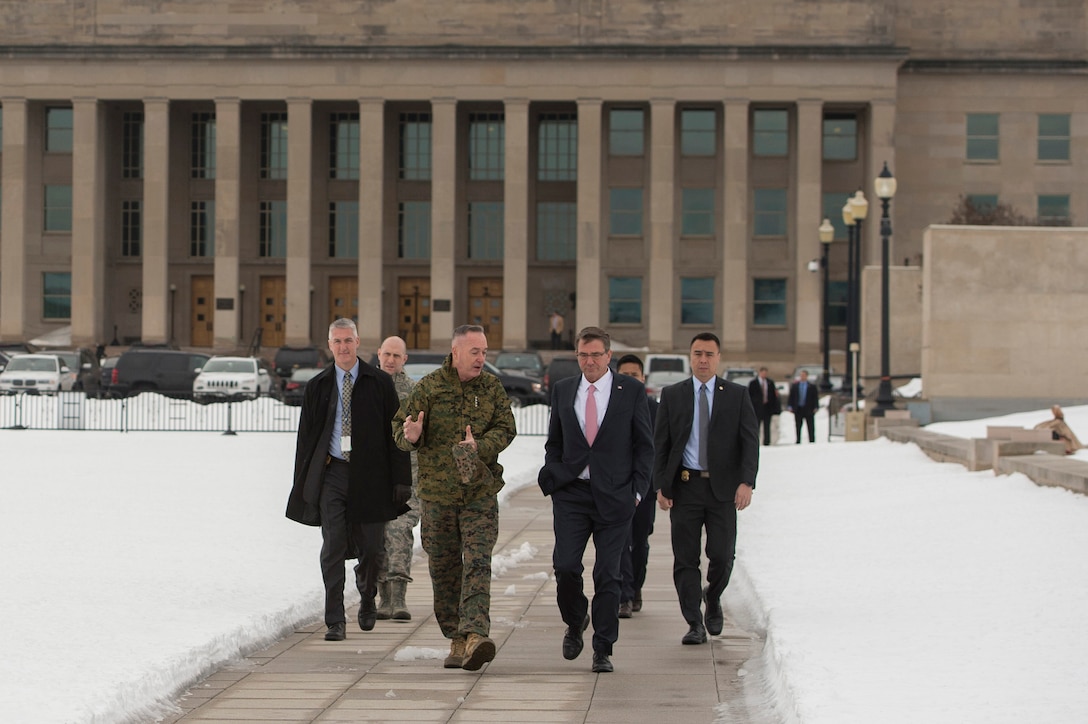 Defense Secretary Ash Carter, center, walks with Marine Corps Gen. Joseph F. Dunford Jr., chairman of the Joint Chiefs of Staff, as they depart the Pentagon to visit U.S. Cyber Command headquarters on Fort George G. Meade, Md., Jan. 27, 2016. DoD photo by Air Force Senior Master Sgt. Adrian Cadiz