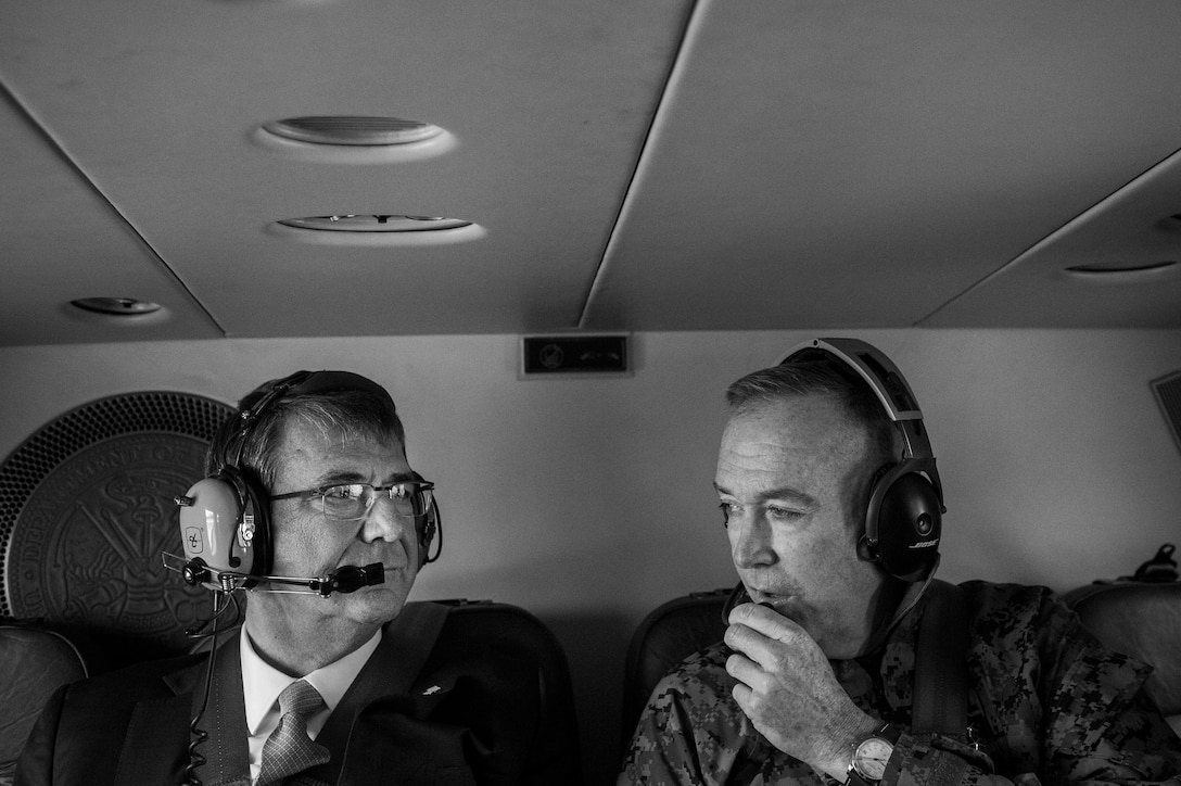 Defense Secretary Ash Carter, left, and Marine Corps Gen. Joseph F. Dunford, chairman of the Joint Chiefs of Staff, talk on helicopter headsets as they fly to U.S. Cyber Command headquarters on Fort George G. Meade, Md, Jan. 27, 2016. DoD photo by Air Force Senior Master Sgt. Adrian Cadiz