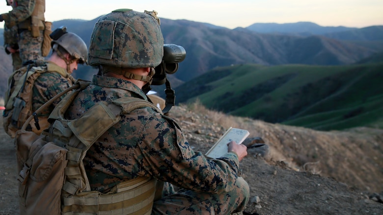 A Joint Fire Observer watches the impact of an 81 mm mortar round to forward corrections needed to accurately hit a target during training on the hillsides of Marine Corps Base Camp Pendleton, California, Jan. 13, 2016. The JFOs work hand-in-hand with the Joint Tactical Attack Controllers to accurately and effectively strike targets with either artillery or aircraft. The Marines are with 1st Air Naval Gunfire Liaison Company, I Marine Expeditionary Force.