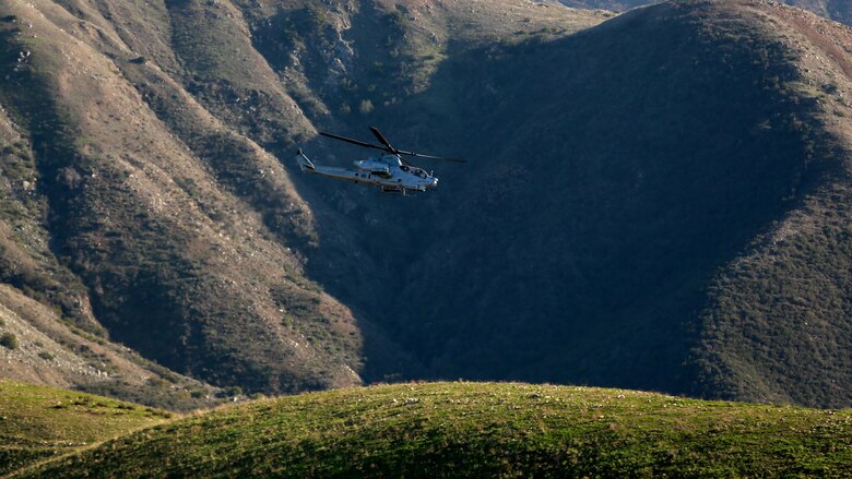 Joint Tactical Attack Controllers conduct training by directing an AH-1W Super Cobra to targets along the hill sides of Marine Corps Base Camp Pendleton, California, Jan. 13, 2016. The Super Cobra uses its three barrel 20mm cannon and launches various rackets to hit its mark with precision. The Marines are with 1st Air Naval Gunfire Liaison Company, I Marine Expeditionary Force.
