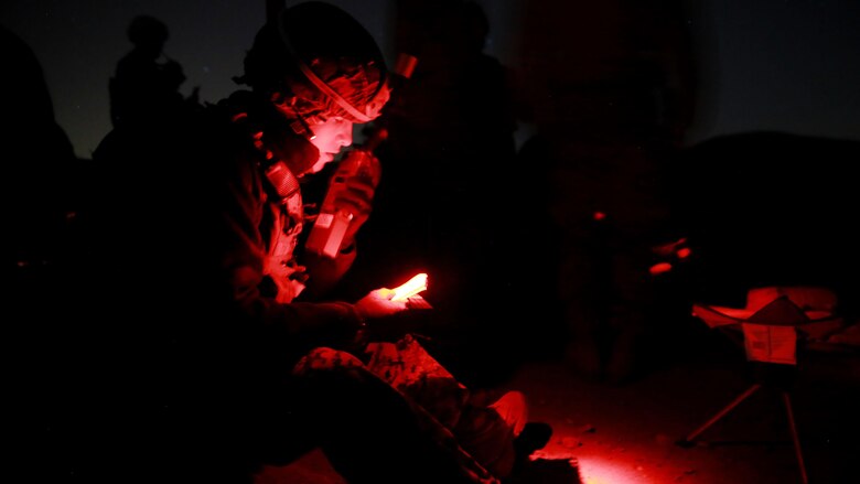 A Marine reads coordinates over the radio to an aircraft flying overhead to accurately and effectively engage the targets scattered along the hillsides of Marine Corps Base Camp Pendleton, California, Jan. 13. 2016. The Marines are Joint Tactical Attack Controllers and Joint Fire Observers who are responsible for directing fires of artillery and aircraft. The Marines are with 1st Air Naval Gunfire Liaison Company, I Marine Expeditionary Force.
