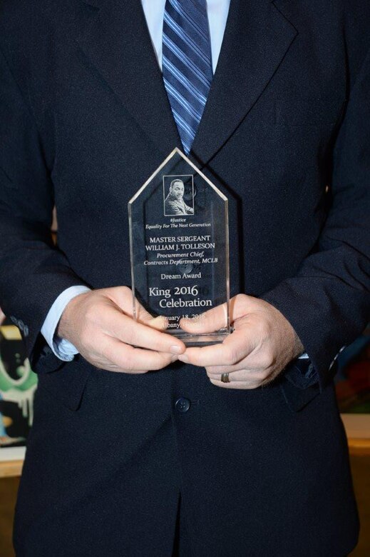 Master Sgt. William Tolleson, procurement chief, Contracts Department, Marine Corps Logistics Command, receives the 2016 Dr. Martin Luther King, Jr., Dream Award at the Albany James H. Gray Sr. Civic Center for the 21st annual King Day Celebration to pay tribute to the life and legacy of Dr. Martin Luther King, Jr., noted civil rights leader, Jan. 19.