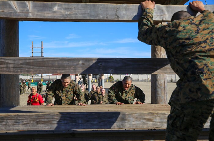 Recruits of Delta Company, 1st Recruit Training Battalion, climb an obstacle during Confidence Course I at Marine Corps Recruit Depot San Diego, Jan. 25. Many of the obstacles test the recruits’ confidence and mental strength in overcoming the challenges before them. Annually, more than 17,000 males recruited from the Western Recruiting Region are trained at MCRD San Diego. Delta Company is scheduled to graduate April 1.