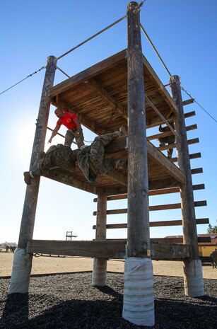 Recruits of Delta Company, 1st Recruit Training Battalion, climb an obstacle during Confidence Course I at Marine Corps Recruit Depot San Diego, Jan. 25. Drill instructors supervised the exercise and advised the recruits on the technique needed to complete it. Annually, more than 17,000 males recruited from the Western Recruiting Region are trained at MCRD San Diego. Delta Company is scheduled to graduate April 1.
