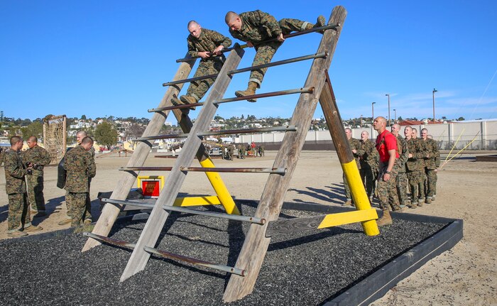 Recruits of Delta Company, 1st Recruit Training Battalion, climb an obstacle during Confidence Course I at Marine Corps Recruit Depot San Diego, Jan. 25. Drill instructors instructed the recruits to move with speed and intensity to ensure that the rest of the recruits got to try every obstacle. Annually, more than 17,000 males recruited from the Western Recruiting Region are trained at MCRD San Diego. Delta Company is scheduled to graduate April 1.