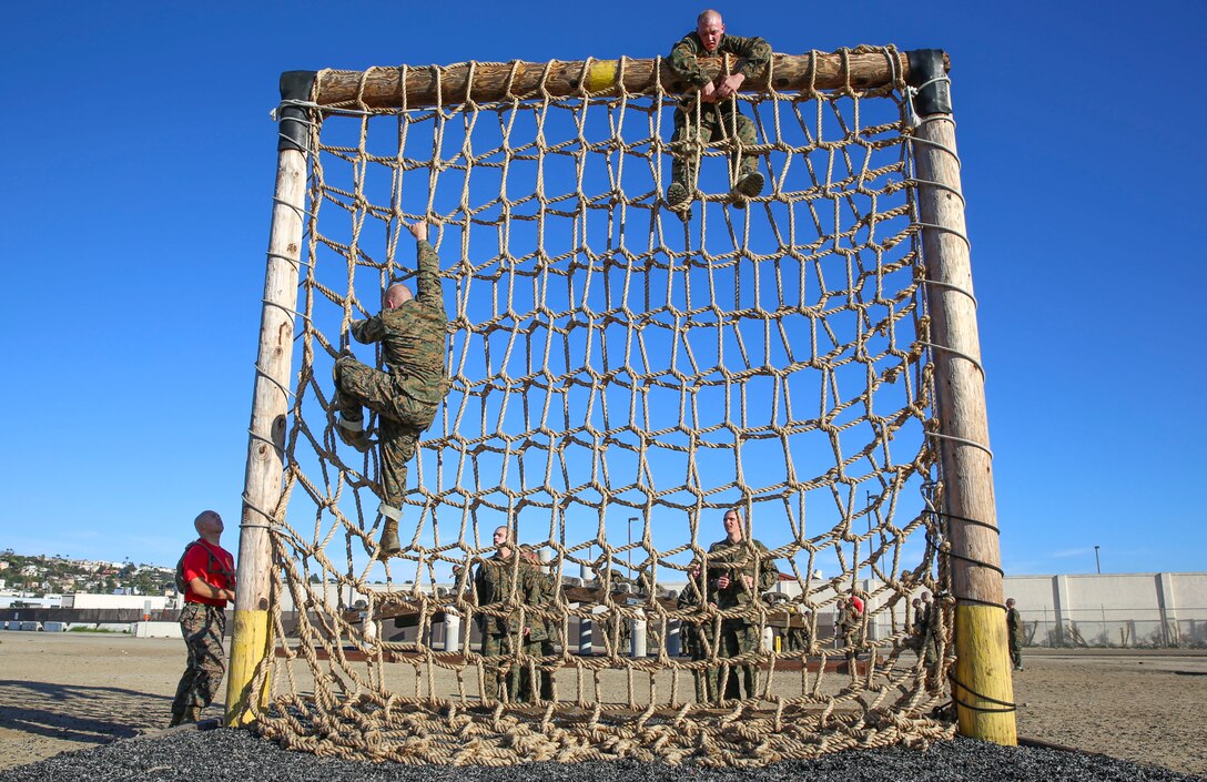 Recruits of Delta Company, 1st Recruit Training Battalion, climb a cargo net during Confidence Course I at Marine Corps Recruit Depot San Diego, Jan. 25. Many of the obstacles test the recruits’ confidence and mental strength in overcoming the challenges before them. Annually, more than 17,000 males recruited from the Western Recruiting Region are trained at MCRD San Diego. Delta Company is scheduled to graduate April 1.