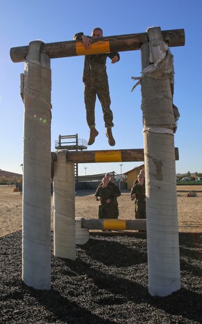 A recruit of Delta Company, 1st Recruit Training Battalion, climbs a high obstacle during Confidence Course I at Marine Corps Recruit Depot San Diego, Jan. 25. Obstacles in the course included the Monkey Bridge, Skyscraper, Wall Climb and several others. Annually, more than 17,000 males recruited from the Western Recruiting Region are trained at MCRD San Diego. Delta Company is scheduled to graduate April 1.
