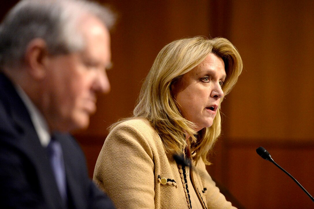 Air Force Secretary Deborah Lee James testifies on the military's space launch capabilities before the Senate Armed Services Committee in Washington, D.C., Jan. 27, 2016. Frank Kendall, foreground, undersecretary of defense for acquisition, technology and logistics, also testified. Air Force photo by Scott M. Ash
