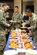 Lt. Col. Erick Castro, right, the 71st Force Support Squadron commander, joins the 86 Team Vance members that helped determine the best entry in the fifth annual “Take a slice off the shelf” pizza tasting at the Vance Library, Jan. 26. (U.S. Air Force photo/ Angela Schoffstall)