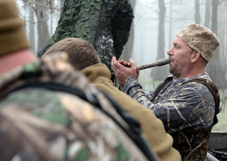 Gunnery Sgt. David A. Kelley, assault amphibious vehicle technician, Marine Corps Systems Command, uses his duck call to call in ducks during Marine Corps Logistics Base Albany’s annual Youth Duck Hunt, Jan. 16.