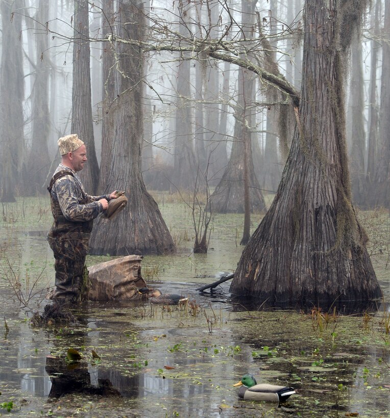 Gunnery Sgt. David A. Kelley, assault amphibious vehicle technician, Marine Corps Systems Command, gathers his spread of ducks at the end of Marine Corps Logistics Base Albany’s annual Youth Duck Hunt, Jan. 16.