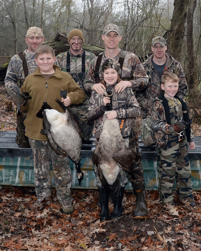 Marine Corps Logistics Base Albany young duck hunters gather at Indian Lake, aboard the installation, for a photo at the end of Marine Corps Logistics Base Albany’s annual Youth Duck Hunt, Jan. 16.