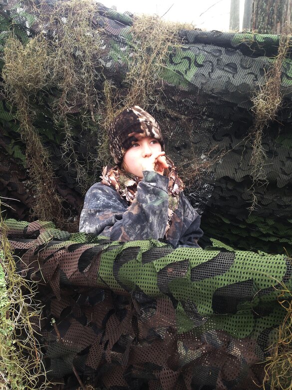 A young duck hunter uses her duck call during Marine Corps Logistics Base Albany’s annual Youth Duck Hunt, Jan. 16.