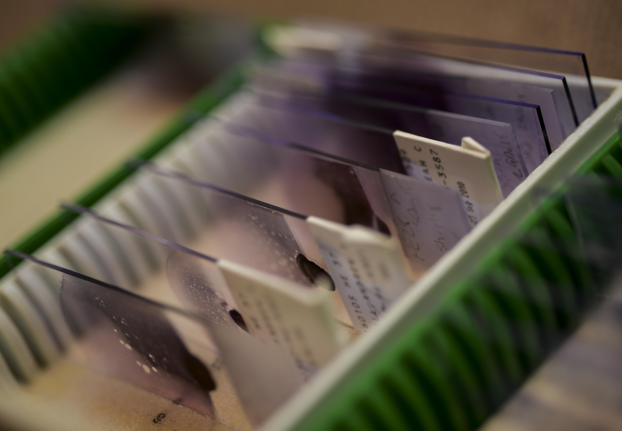 A blood smear slide case stores samples being prepared for analysis at Barksdale Air Force Base, La., Jan. 26, 2016. Blood smear slides are stored for up to a week post inspection and include patients name, the date it was made and initials of the technician that created it as part of a look back system for future reviews. (U.S. Air Force photo/Airman 1st Class Mozer O. Da Cunha)

