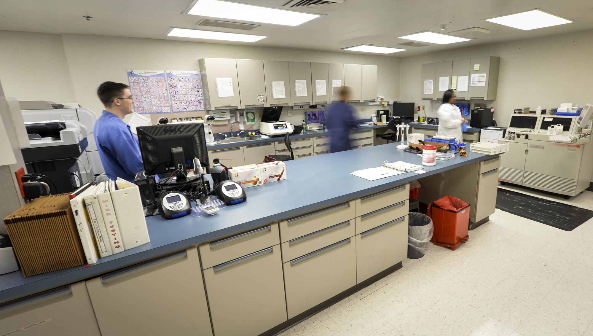 Laboratory technicians with the 2nd Medical Support Squadron move samples at Barksdale Air Force Base, La., Jan. 26, 2016. Barksdales laboratory technicians processed about 128,000 samples during 2015, providing doctors with information used for patient diagnostics. (U.S. Air Force photo/Airman 1st Class Mozer O. Da Cunha)