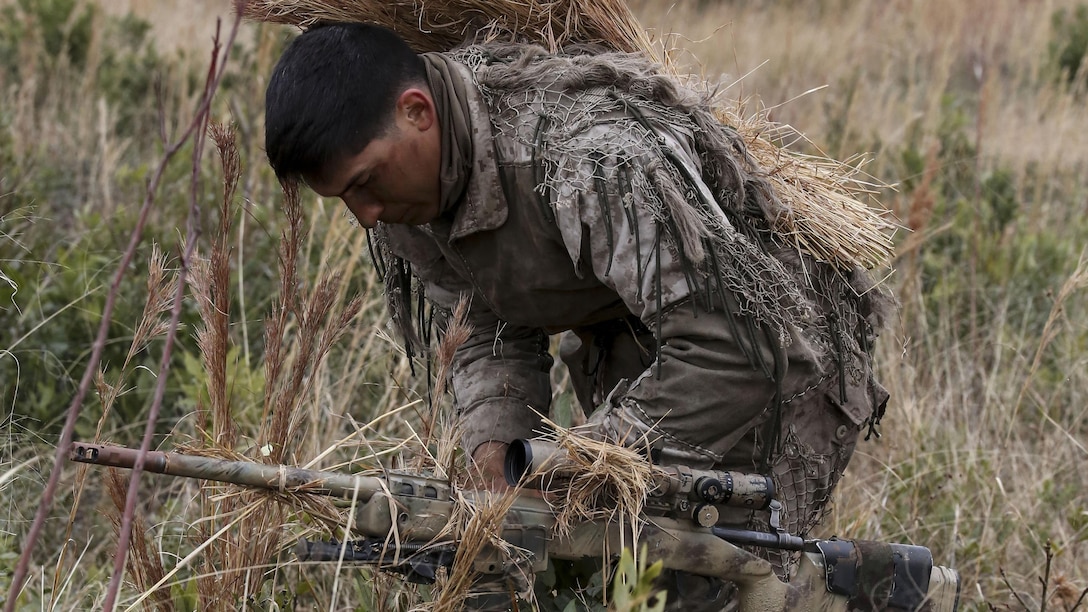 Corporal Brighten Bell, a student undergoing the 2nd Marine Division Combat Skills Center Pre-Scout Sniper Course, prepares to move during a stalking exercise at Marine Corps Base Camp Lejeune, North Carolina, Jan. 22, 2016. The DCSC offers several infantry-based courses to enhance the combat readiness of its Marines.