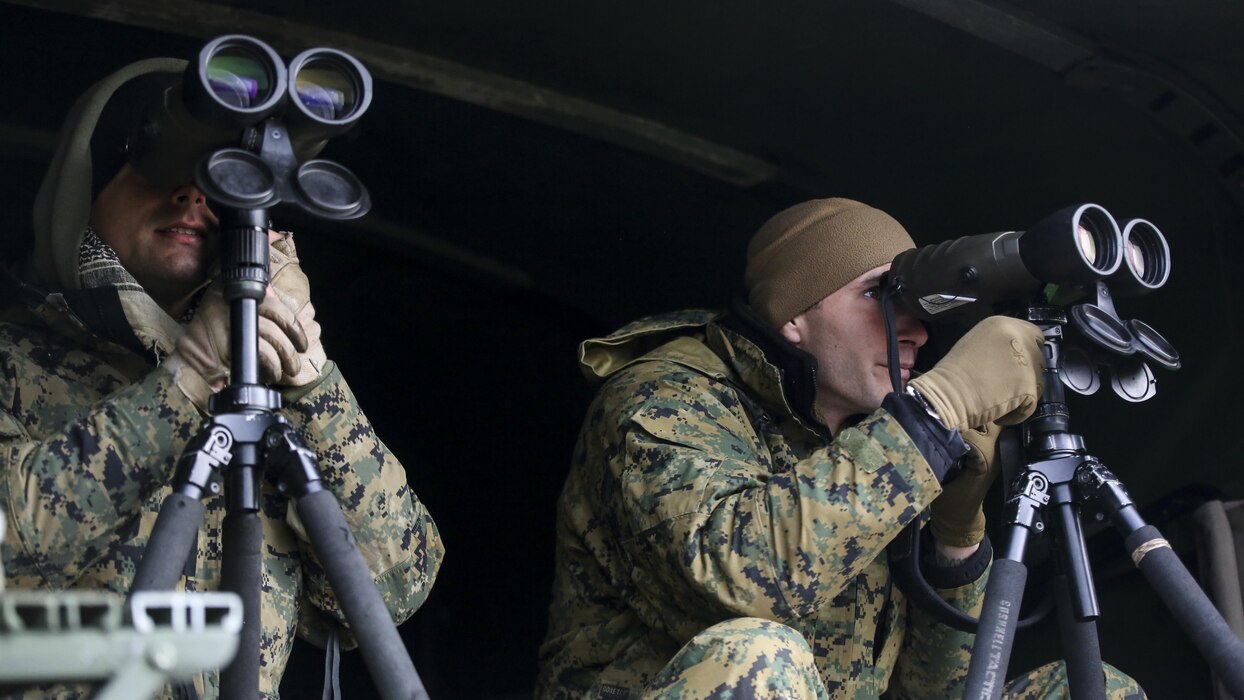 Sergeants Douglas Cairn, left, and Bradley Brouwer, right, instructors in the 2nd Marine Division Combat Skills Center’s Pre-Scout Sniper Course, search for students during a stalking exercise at Marine Corps Base Camp Lejeune, North Carolina, Jan. 22, 2016. The DCSC offers several infantry-based courses to enhance the combat readiness of its Marines.