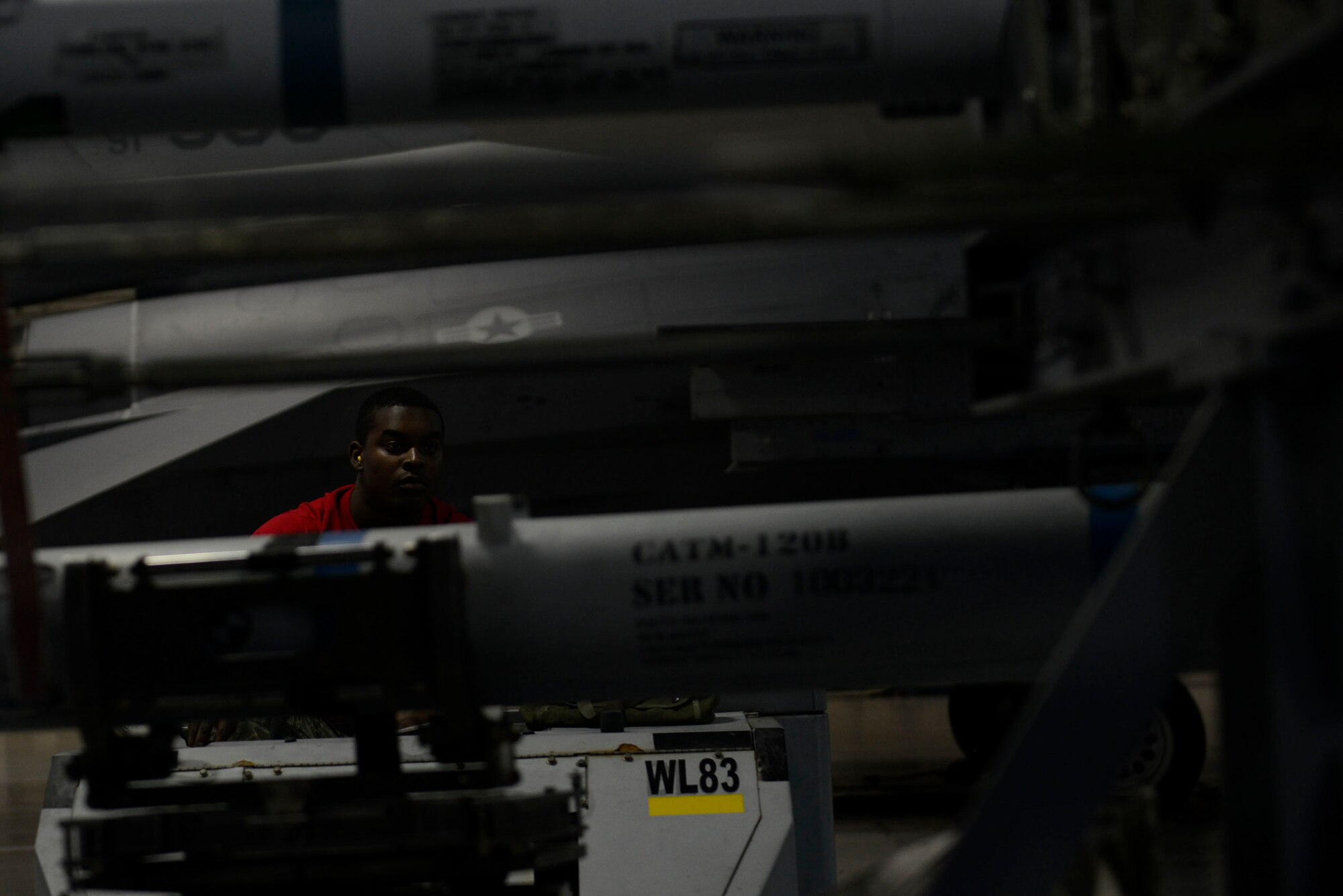 U.S. Air Force Senior Airman Chelloe Hamilton, 20th Aircraft Maintenance Squadron, 77th Aircraft Maintenance Unit weapons load crew member, transports an AIM-9X training munition using a bomb loader during a Load Crew of the Year competition at Shaw Air Force Base, S.C., Jan. 22, 2016. The competition showcased the Airmen’s skills and job knowledge, while also building camaraderie amongst the units. (U.S. Air Force photo by Airman 1st Class Christopher Maldonado)