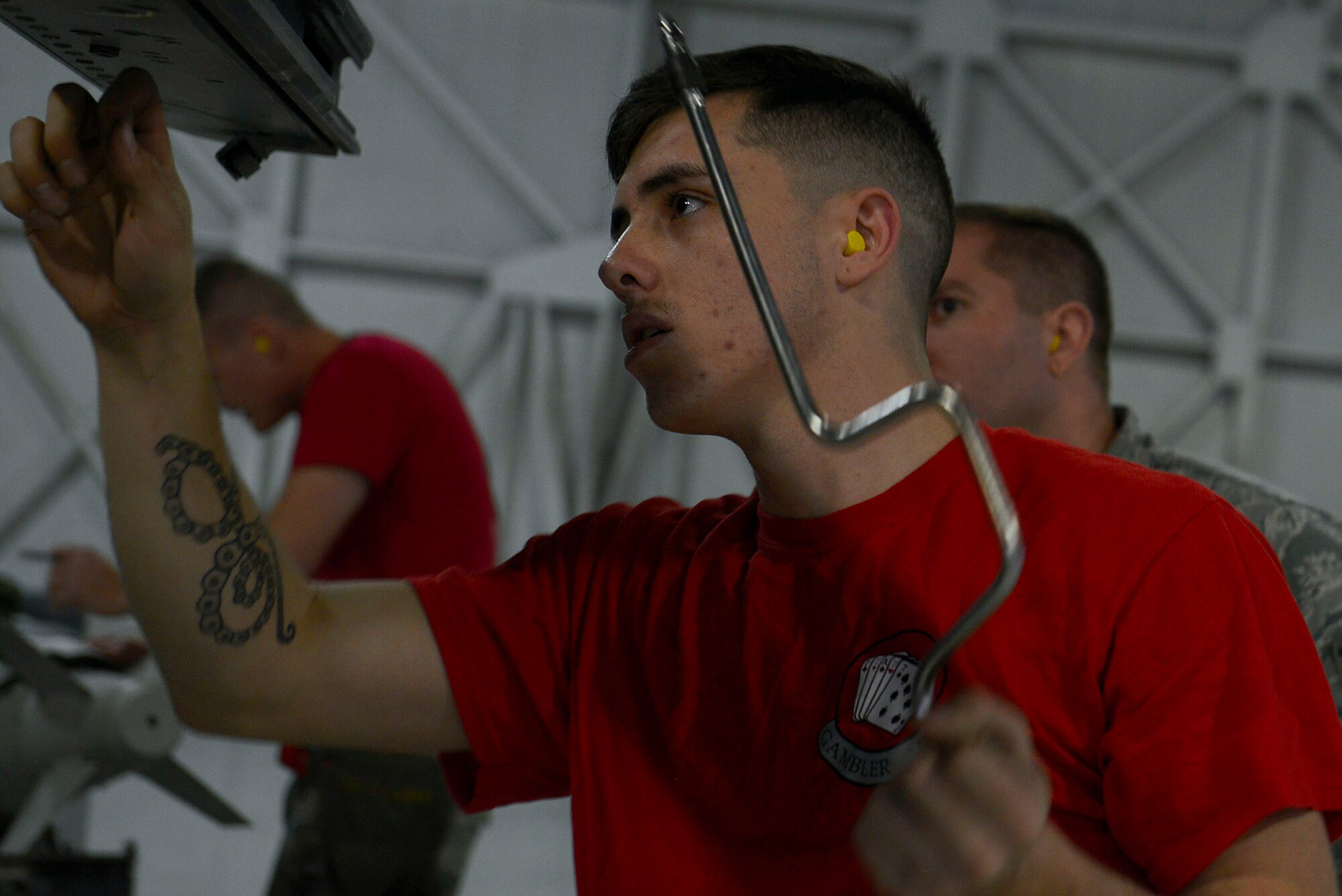 U.S. Air Force Airman 1st Class JT Owens, 20th Aircraft Maintenance Squadron, 77th Aircraft Maintenance Unit weapons load crew member, inspects a bolt on an F-16CM Fighting Falcon during a Load Crew of the Year competition at Shaw Air Force Base, S.C., Jan. 22, 2016. Owens and his team competed against three teams to earn the title of Load Crew of the Year. (U.S. Air Force photo by Airman 1st Class Christopher Maldonado)  