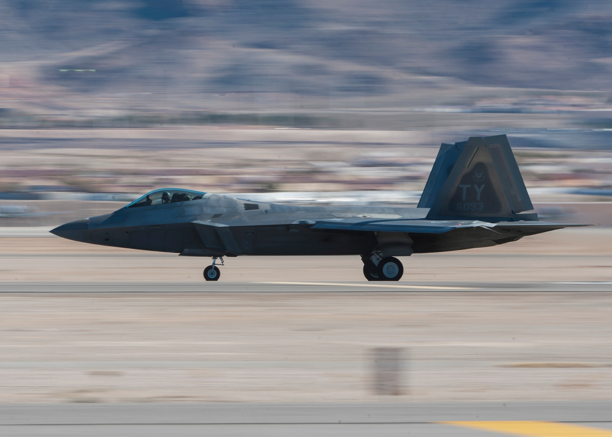 An F-22 Raptor from the 325th Fighter Wing, 95th Fighter Squadron, Tyndall Air Force Base, Fla., takes off from Nellis AFB to participate in a Red Flag 16-1 exercise Jan. 26, 2016. Red Flag is celebrating its 41st anniversary with Red Flag being a realistic combat training exercise involving the air, space and cyber forces of the U.S. and its allies, and is conducted on the vast bombing and gunnery ranges on the Nevada Test and Training Range. (U.S. Air Force photo by Senior Airman Jake Carter)