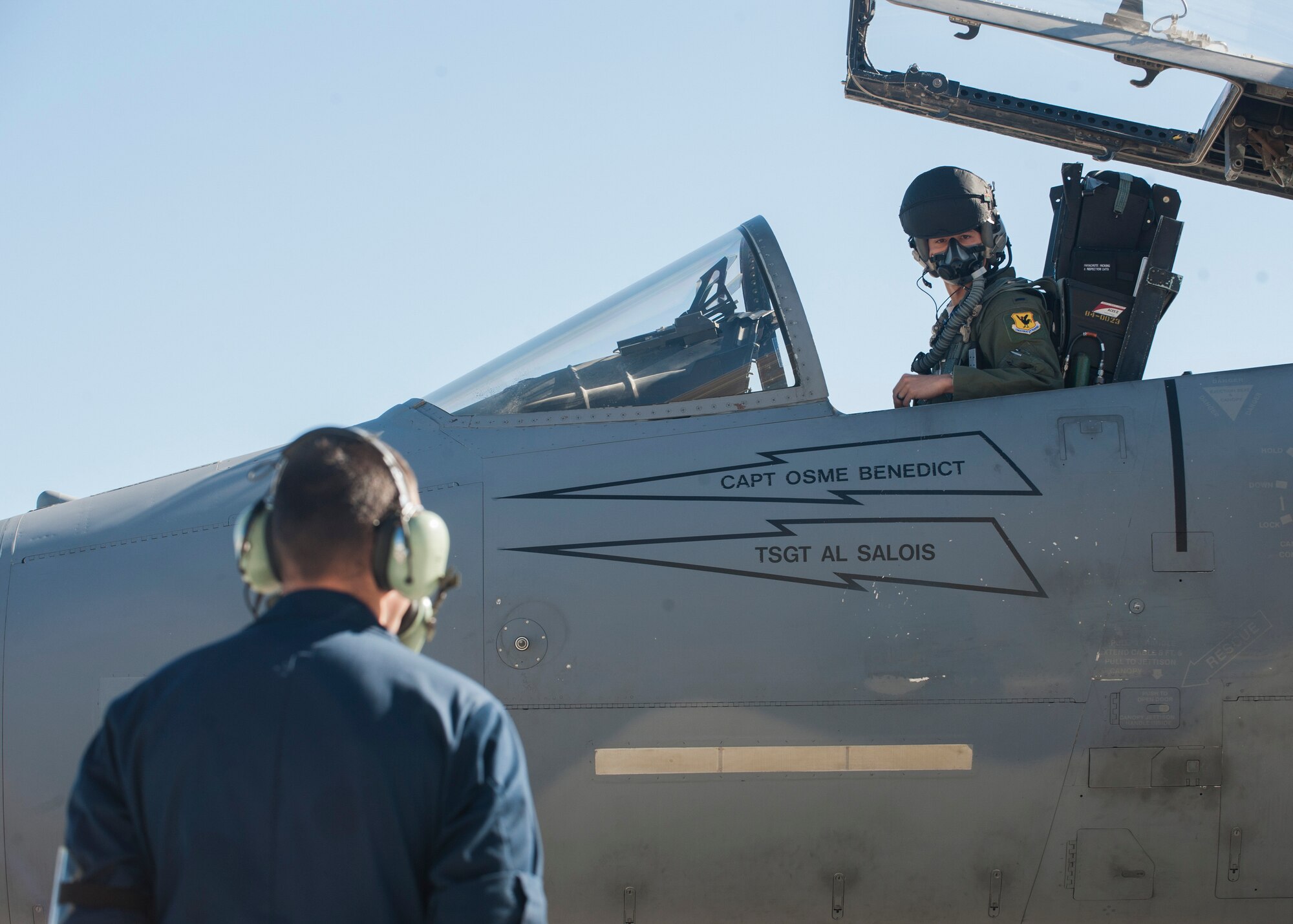 A pilot from the 104th Fighter Wing, 131st Fighter Squadron, Barnes Air National Guard Base, Mass., waits for instruction from his crew chief in preparation for take-off during Red Flag 16-1 Jan. 26, 2016, at Nellis AFB. Flying units from around the globe deploy to Nellis AFB to participate in Red Flag, where it is held four times a year and organized by the 414th Combat Training Squadron. (U.S. Air Force photo by Senior Airman Jake Carter)