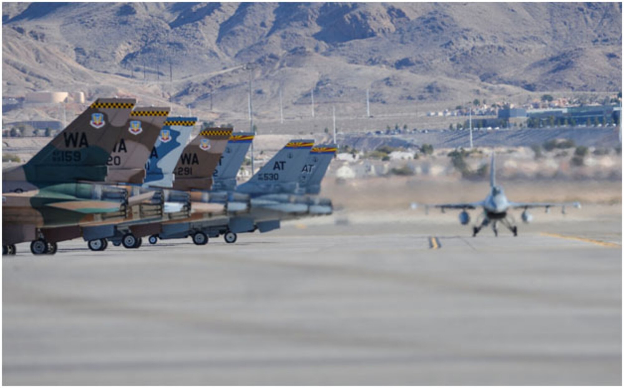 An F-16 Fighting Falcon gets in position before take-off during Red Flag 16-1 at Nellis Air Force Base, Nev., Jan 25, 2016. Red Flag involves a variety of attack, fighter, bomber, reconnaissance, electronic warfare, air lift support and search and rescue aircraft. (U.S. Air Force photo by A1C Kevin Tanenbaum)