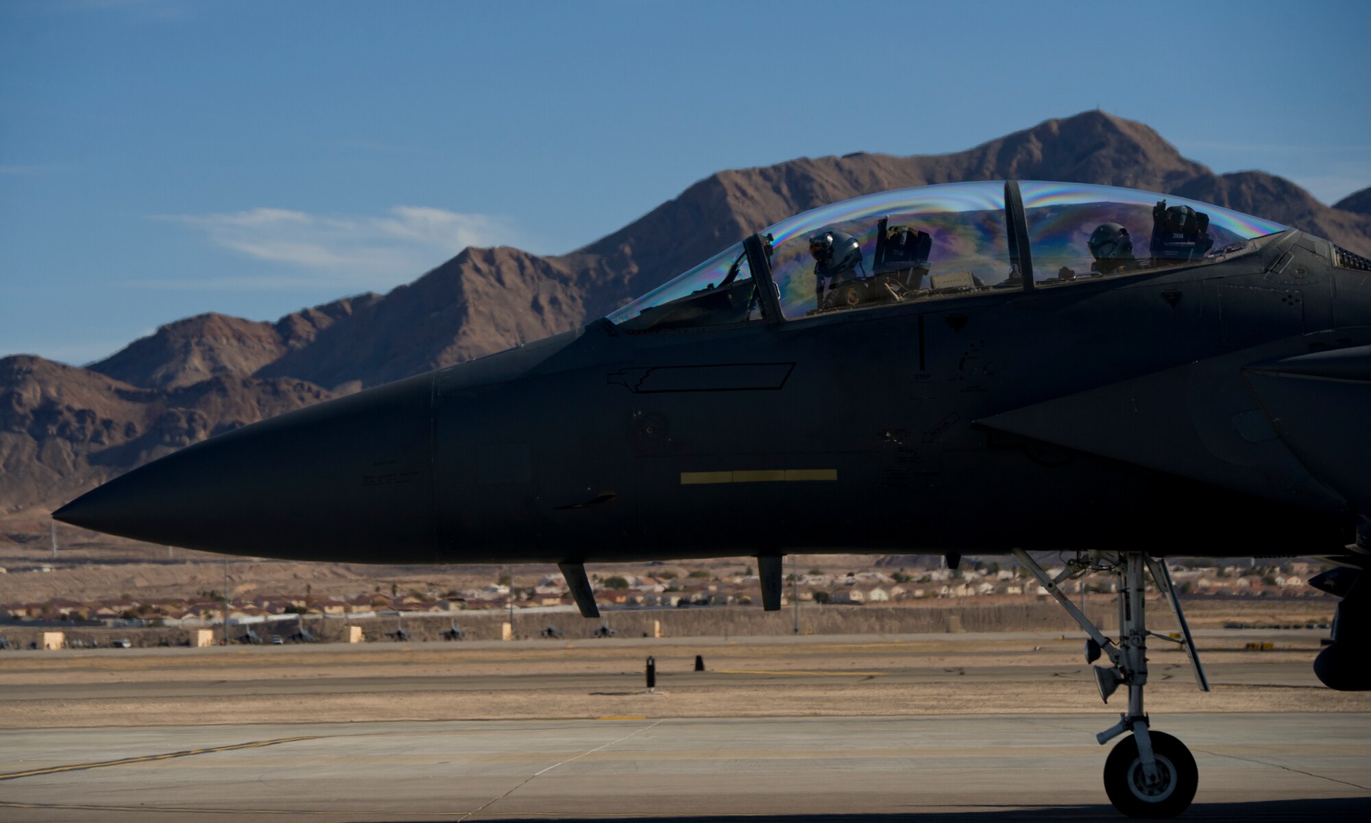 An F-15E Strike Eagle from Seymour Johnson AFB, North Carolina taxis on the Nellis flightline before takeoff, Jan. 25. More than 30 squadrons at Red Flag 16-1 will work together as they would in the field bringing them all together, possibly for the first time, before facing an actual threat. (U.S. Air Force photo by Senior Airman Alex Fox Echols III/Released)  